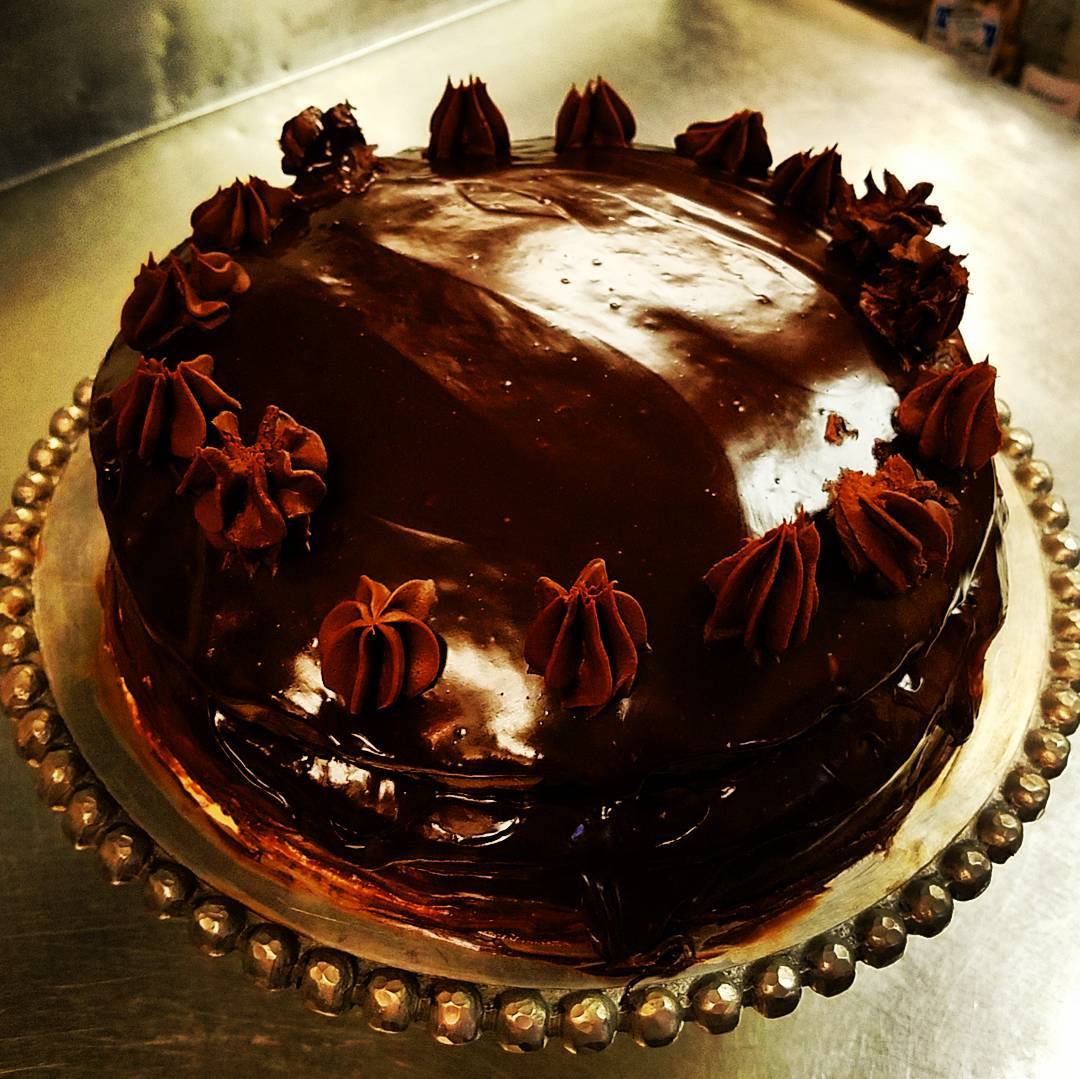Va Bene Instagram Photo: @vabenecaffe Deep, dark, rich chocolate cake filled with pastry cream and apricot ??.Introducing Captain Midnight, named for my mom's childhood nickname #itsallaboutthatchocolate #bakermom #baking #desserts #saveroomfordessert #capitano #mezzonotte